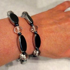 Beautiful double strand of crystal and oblong metallic beads bracelets.